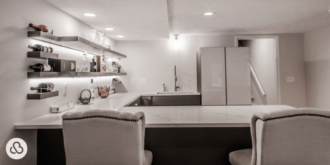 Greater Lansing basement remodeling project with floating shelves and bar