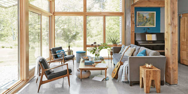 sunroom addition cost vs roi is it a smart investment four seasons room with large windows and indoor foliage custom built michigan