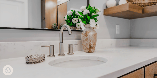how to select the perfect countertops for your bathroom remodel quartz countertop with silver faucet and mirror custom built michigan