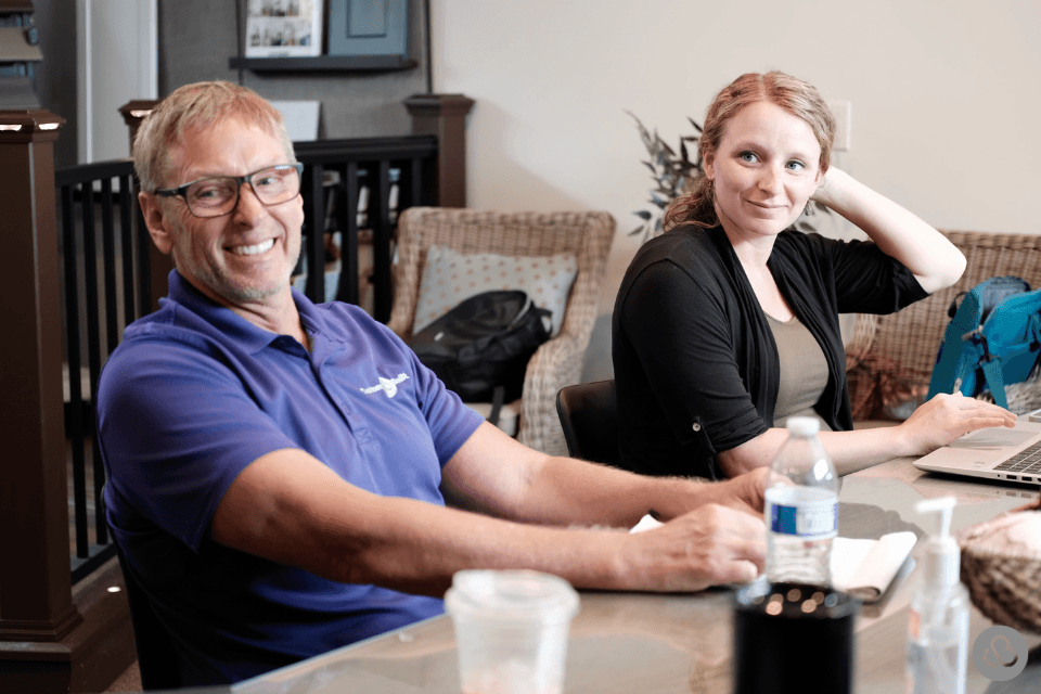 design build firm team members discussing home remodeling project custom built michigan