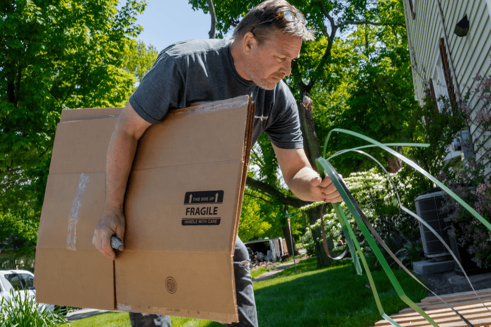 how to check remodeling contractor references and reviews remodeler inspecting outdoor living space custom built michigan