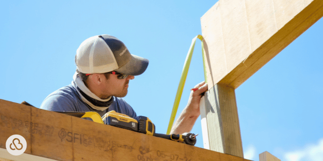 Greater Lansing home remodeling measuring lumber for spring remodel