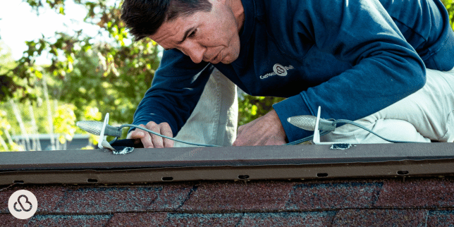 why roofing inspections are critical to ensuring the longevity of your roof contractor inspecting ridge custom built michigan