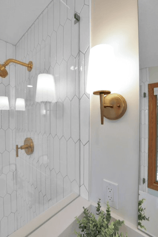 Tile bathroom with antique light fixtures