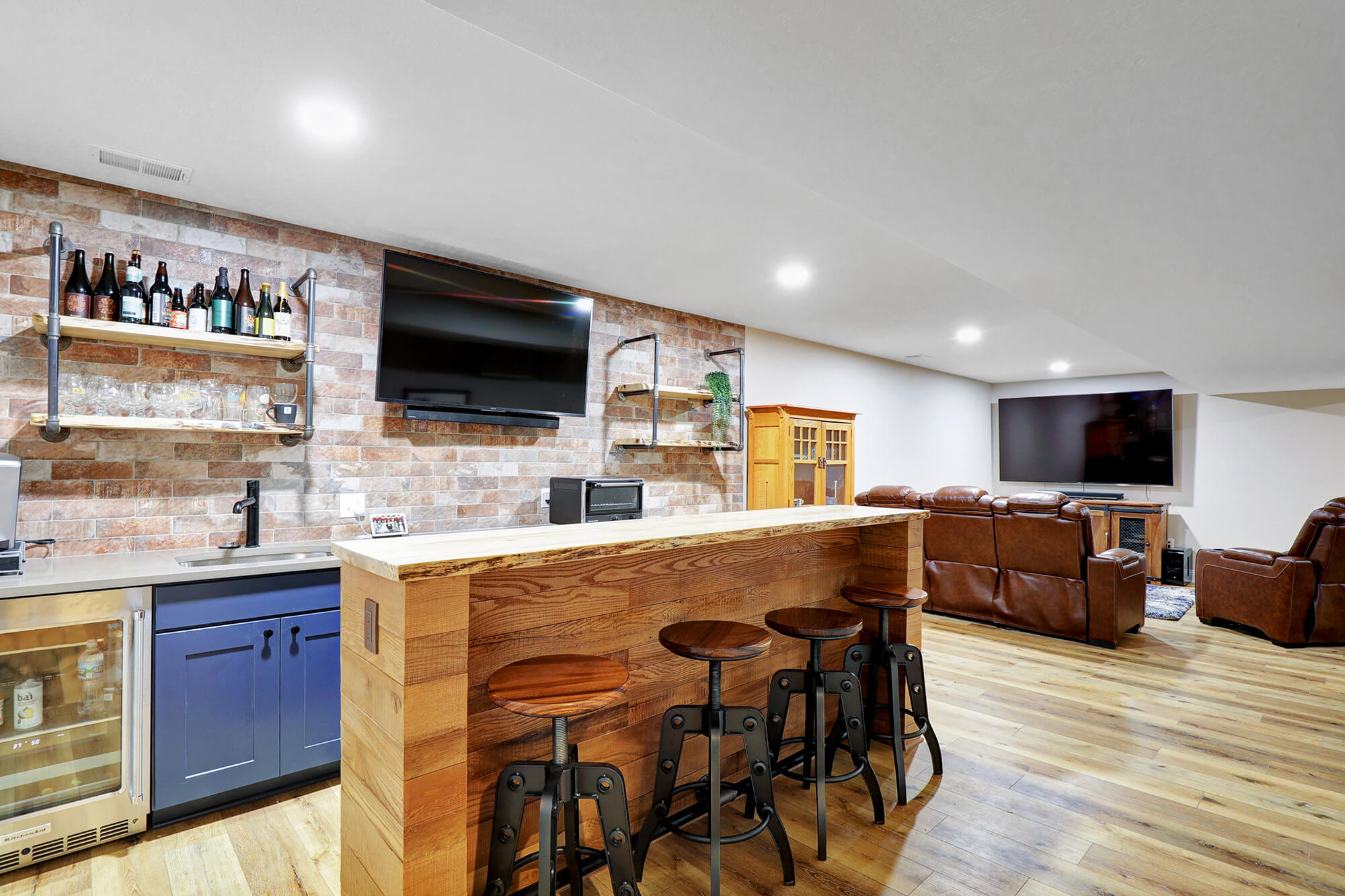 Well-lit basement bar area