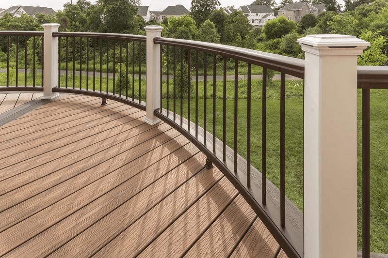 Deck railing surrounding curved deck surface