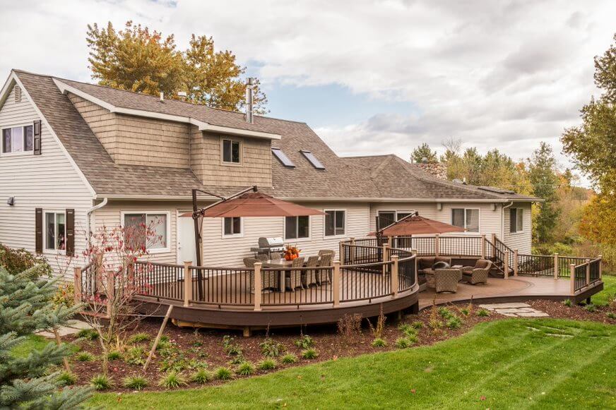 Outdoor deck with curved edges and seating areas
