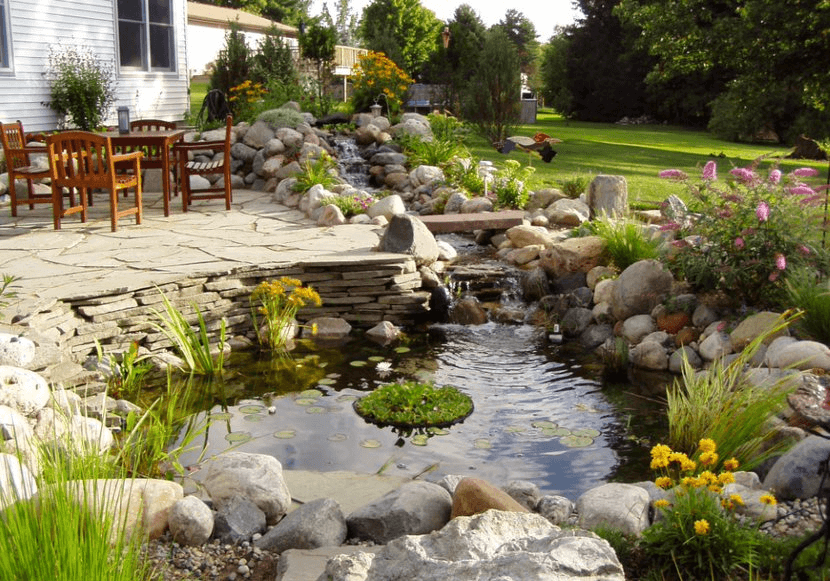 small waterfall in a backyard area