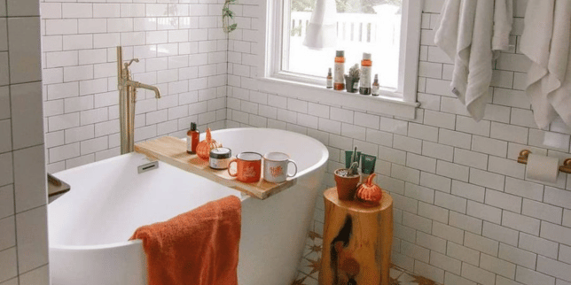 top fall bathroom remodel ideas for comfort and style freestanding bathtub with subway tile walls and autumn decor custom built michigan