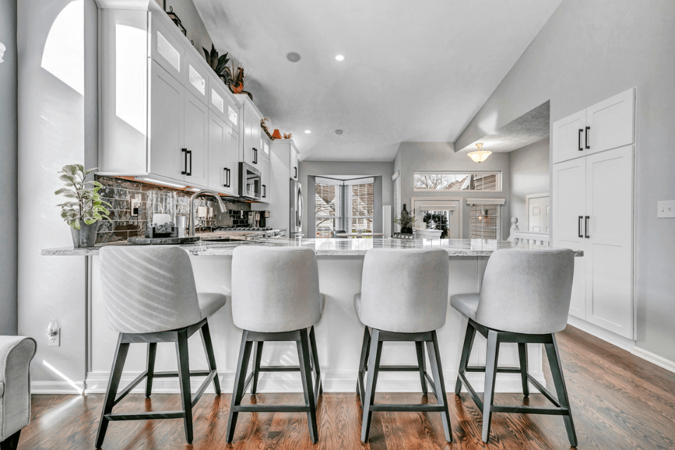 luxury kitchen remodel cost island with chairs and white cabinets custom built