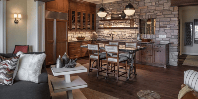 top questions to ask basement finishing contractors before you hire large wet bar space with dining table and cabinets custom built michigan