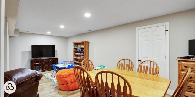 finished basement project in Greater Lansing Michigan built by Custom Built Design and Remodeling with play area and dining table