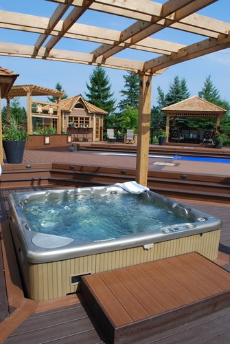 Hot tub on a deck with a pergola