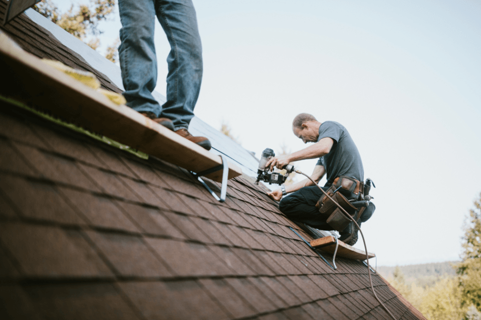 home remodeling general contractor working on rooftop custom built michigan