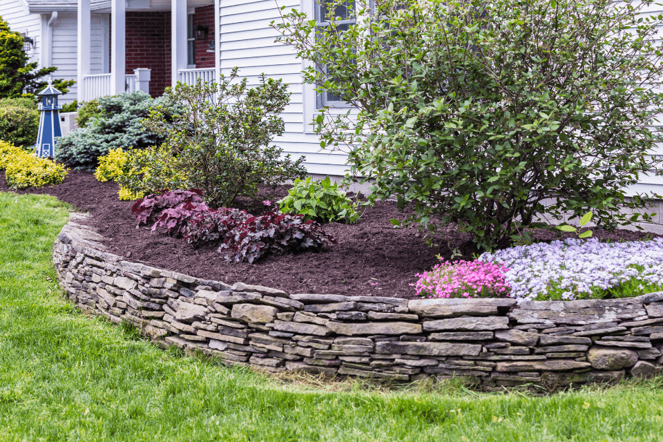 top landscaping companies in boyne city michigan stone planter with greenery custom built michigan
