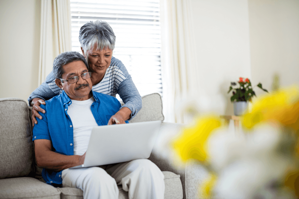 common planning mistakes to avoid for your home remodel couple on laptop custom built michigan