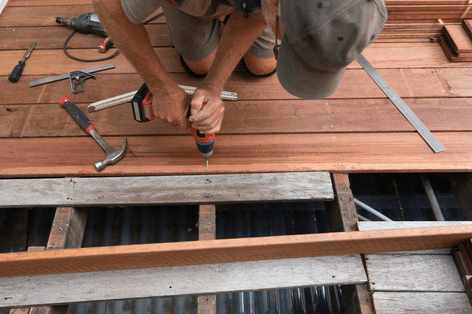 mistakes to avoid while hiring a remodeling contractor deck builder drilling decking boards custom built michigan