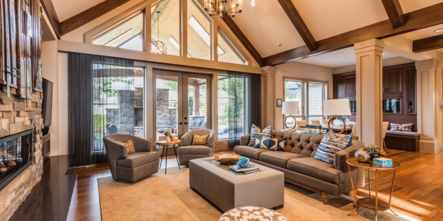 how the custom built team works with vacation homeowners in northern michigan cabin living room and large windows boyne city
