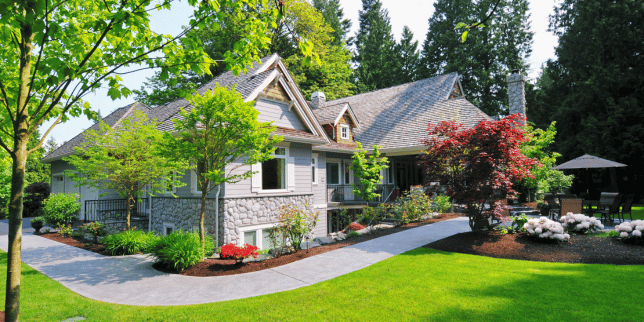 spring remodeling checklist how to refresh your home after winter front yard with foliage and stone pathway custom built michigan