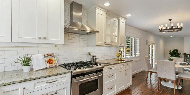 how tariffs will affect your home remodeling project kitchen remodel with new range and tile backsplash custom built michigan
