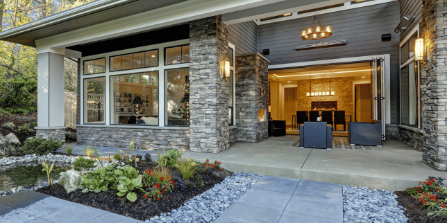 top outdoor lighting ideas for your home remodel sconce fixture attached to stone column in living space custom built michigan
