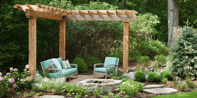 signs your outdoor living space is ready for a remodel patio with fire pit and pergola custom built michigan