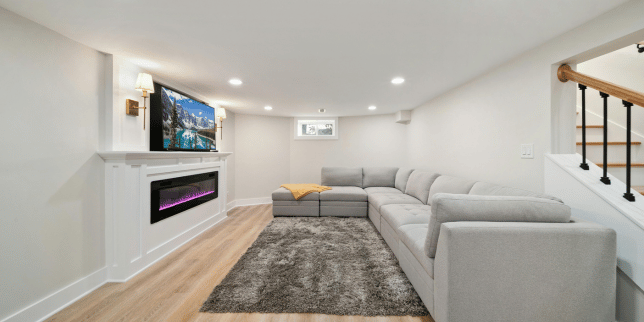 top cost effective upgrades for your basement remodel living space with tv and fireplace custom built michigan