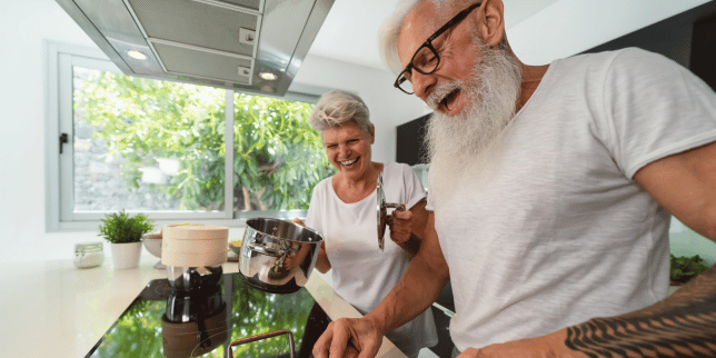 common issues with aging in place remodeling projects elderly couple cooking together custom built michigan