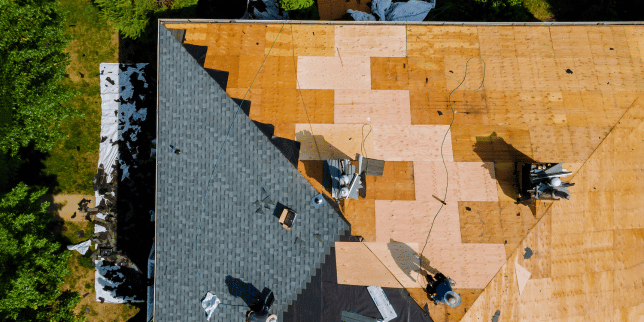misconceptions about roof replacement projects in michigan roofing contractors installing new shingles custom built okemos