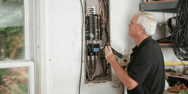 how home remodeling inspections work inspector checking electricity board custom built michigan