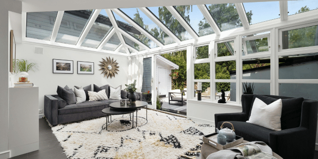 what to expect during a home addition project sunroom with glass windows and roofing custom built michigan