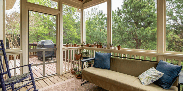 questions to ask before hiring a screened in porch builder outdoor living space with couch and bbq grill custom built michigan