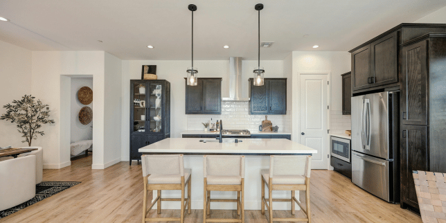 how to decide where to put features in your kitchen remodeling project large island with pendant lighting and sink custom built michigan