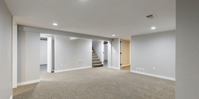 Greater Lansing basement remodeling project with new carpet flooring and lighting