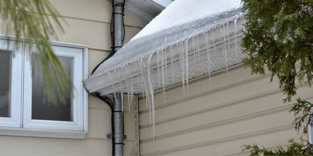ice dam on Greater Lansing Michigan roof and siding