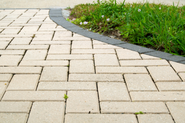 paver concrete pathway with greenery and herringbone pattern in Lansing Michigan
