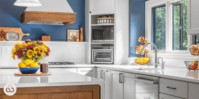 luxury kitchen with blue walls and elegant island in Lansing Michigan