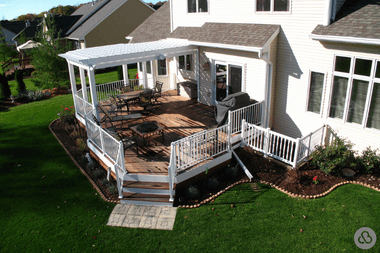 white pergola with white railings and dining area on composite deck custom built