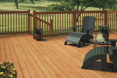 comparing decking materials for your michigan outdoor living space pressure treated wood deck with furniture custom built okemos