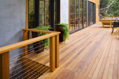 comparing decking materials for your michigan outdoor living space cedar deck with glass doors custom built okemos