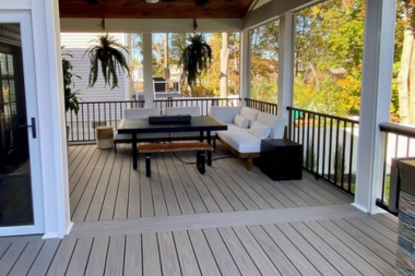 comparing decking materials for your michigan outdoor living space trex composite deck with roof and furniture custom built okemos