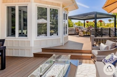 composite decking project in Greater Lansing Michigan built by Custom Built Design and Remodeling with fire pit and pergola