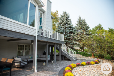 Lansing outdoor living space with composite deck and patio underneath