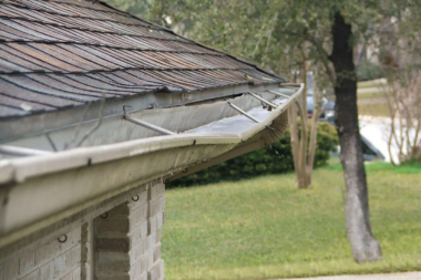 bowing roof gutters on Greater Lansing Area home