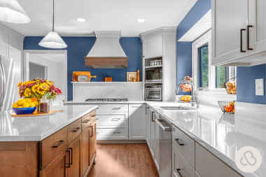 Lansing kitchen remodel with blue walls and decorative range hood