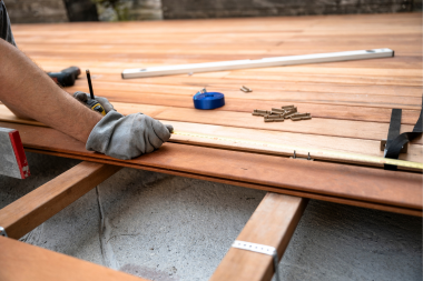 licensed Lansing deck builder installing composite decking