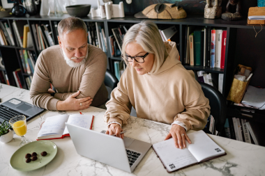 Lansing Michigan couple planning their home remodeling project at long desk