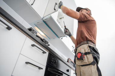 Greater Lansing kitchen remodeler installing cabinets