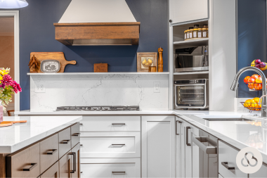 luxury kitchen remodel in Greater Lansing with tile backsplash and elegant cabinetry