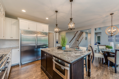 elegant kitchen remodel with quartz island in Greater Lansing